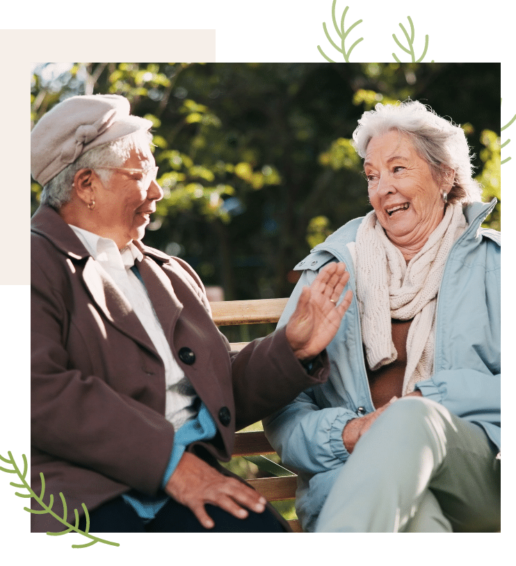Two Women Laughing on a Park Bench